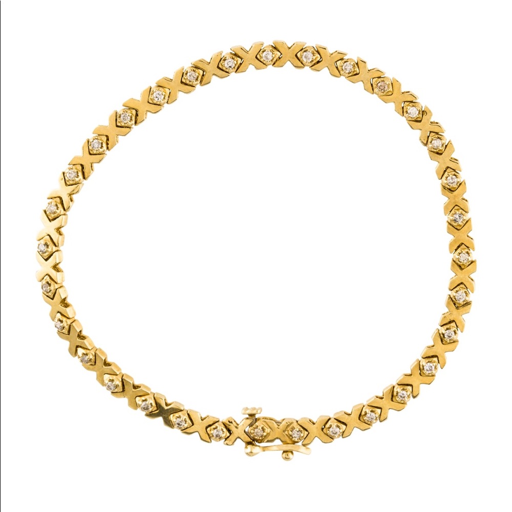14kt solid yellow gold diamond xoxo link bracelet.